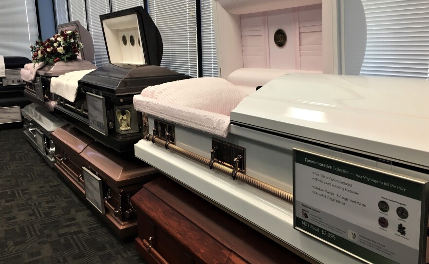Caskets on display at Serenity Funeral Home in Kansas City, Mo., where many of the city's homicide victims are memorialized.