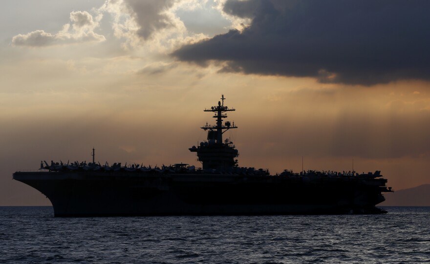 The aircraft carrier USS Theodore Roosevelt aircraft carrier anchored off Manila Bay west of Manila, Philippines, in a photo from 2018.