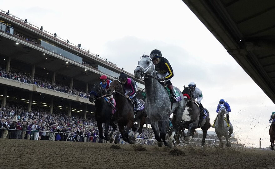 Joel Rosario rides Knicks Go, foreground, to victory during the Breeders' Cup Classic race at the Del Mar racetrack in Del Mar, Calif., Saturday, Nov. 6, 2021.