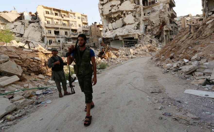Syrian rebel fighters in the northern city of Aleppo in August. The Obama administration has been vetting rebel groups and decided that more than a dozen are moderate enough to arm.