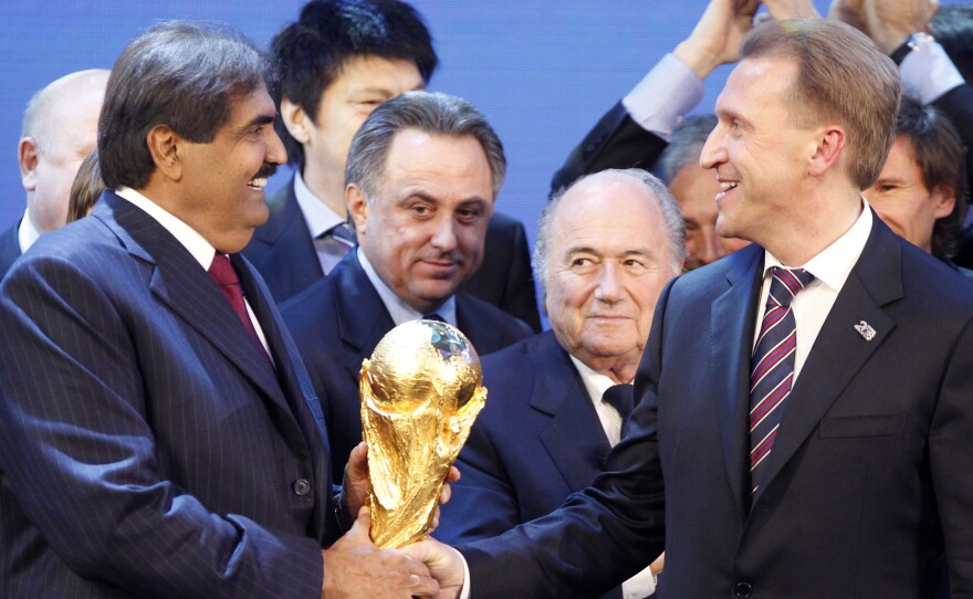FIFA President Joseph Blatter (second right) is flanked in Zurich, Switzerland, on Dec. 2, 2010, by Russian Deputy Prime Minister Igor Shuvalov (right) and Qatar's Emir Sheikh Hamad bin Khalifa Al-Thani after the announcement that Russia will host the soccer World Cup in 2018 and Qatar in 2022.