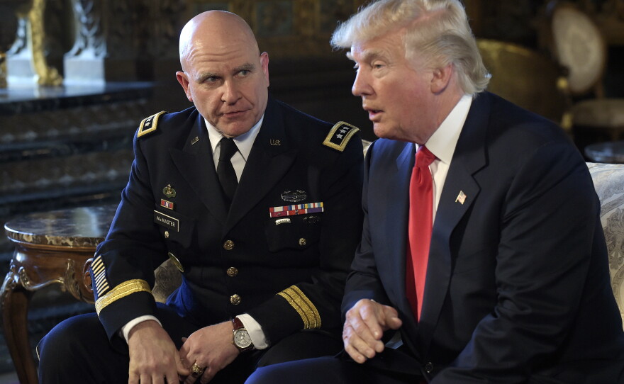 President Donald Trump speaks as Army Lt. Gen. H.R. McMaster listens at Mar-a-Lago in Palm Beach, Fla., in February 2017.