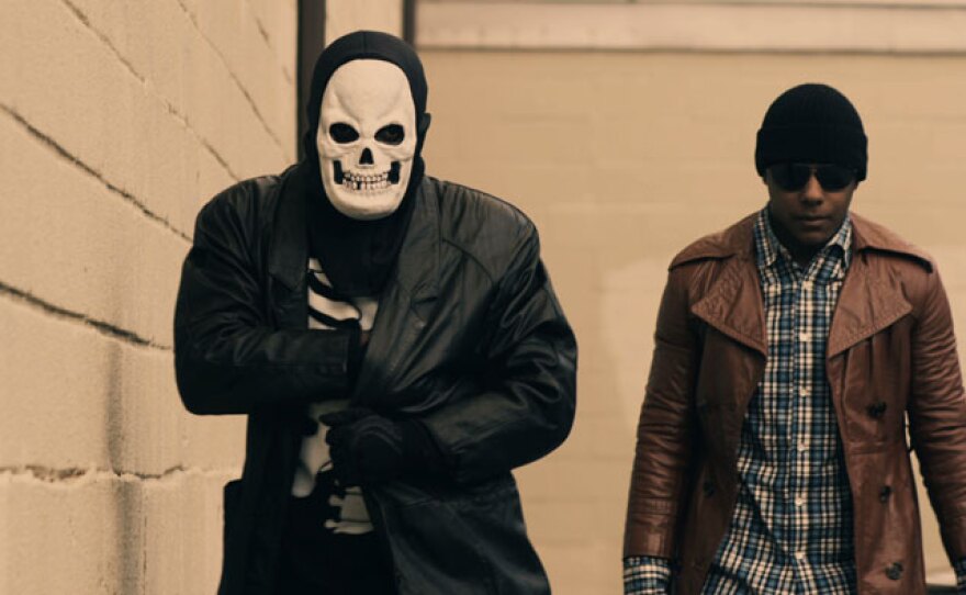 Still from film’s reenactment of Darius Monroe and accomplice on the way to rob a bank.