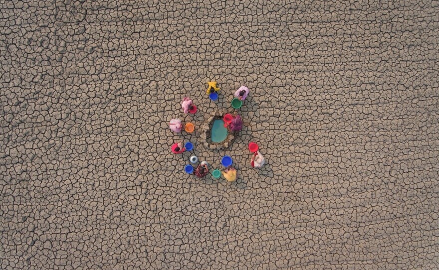 Women collect water from a dry riverbed in Khulna, Bangladesh. This photo was one of the "highly commended" images from this year's Drone Photo Contest.