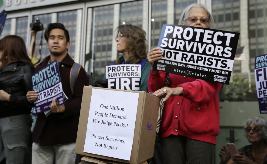 Activists rally to call for the removal of Superior Court Judge Aaron Persky in San Francisco in June over his ruling in a sexual assault case. On Friday, the judge was transferred from criminal to civil court.