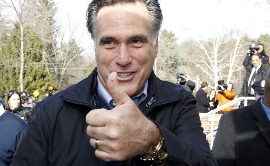 Former Massachusetts Gov. Mitt Romney appeared outside a polling station at Webster School in Manchester Tuesday as people across New Hampshire voted in the state's primary.