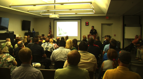 Lt. John Sandmeyer talks to emergency officials and county leaders at the Office of Emergency Services about the San Diego Fire Department's preparations for the coming El Niño, Oct. 13, 2015.