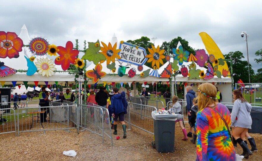 Festival goers file through the entrance to Kendal Calling, a four-day outdoor music festival in England's Lake District. For the first time, attendees can have their illegal drugs tested before they take them as part of a new project to prevent overdoses.