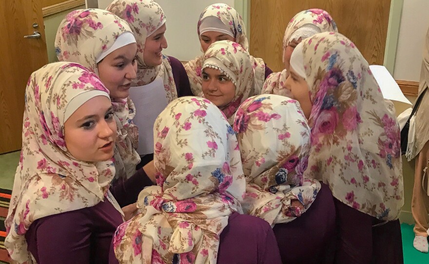 A girls' choir at the Bosnian Islamic Cultural Center in Chicago gather after performing for the congregation.