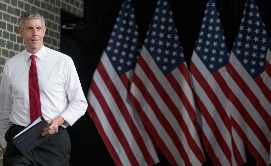 Secretary of Education Arne Duncan takes the stage at North High School in Des Moines, Monday, Sept. 14, 2015, to discuss college access and affordability.
