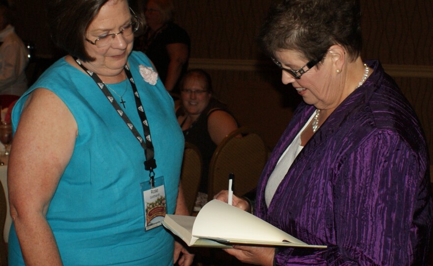Macomber's readers feel like they have a personal relationship with the author, who happily poses for photos and signs books for endless lines of fans.