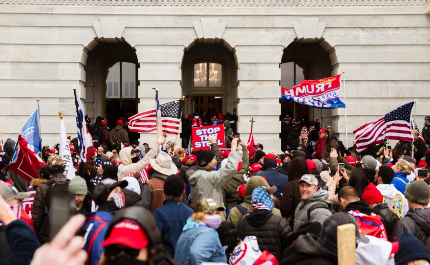 A destructive mob of Trump supporters floods into the U.S. Capitol on Jan. 6. The president was criticized for inciting the rioters and for failing to quell the insurrection.