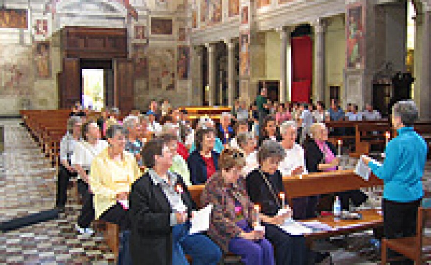 Female pilgrims from FutureChurch in prayer at St. Praxedes church in Rome.