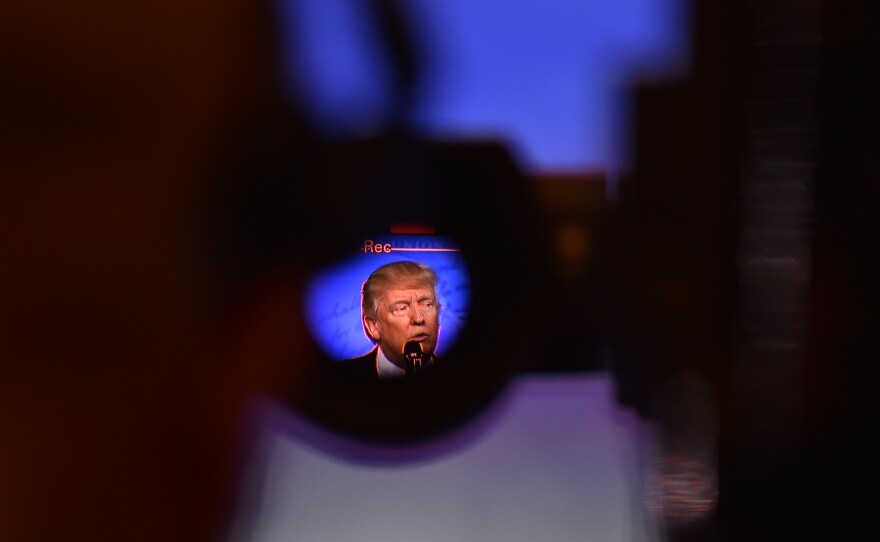 Through a video camera viewfinder, President Trump is seen addressing the crowd during the Conservative Political Action Conference in February.