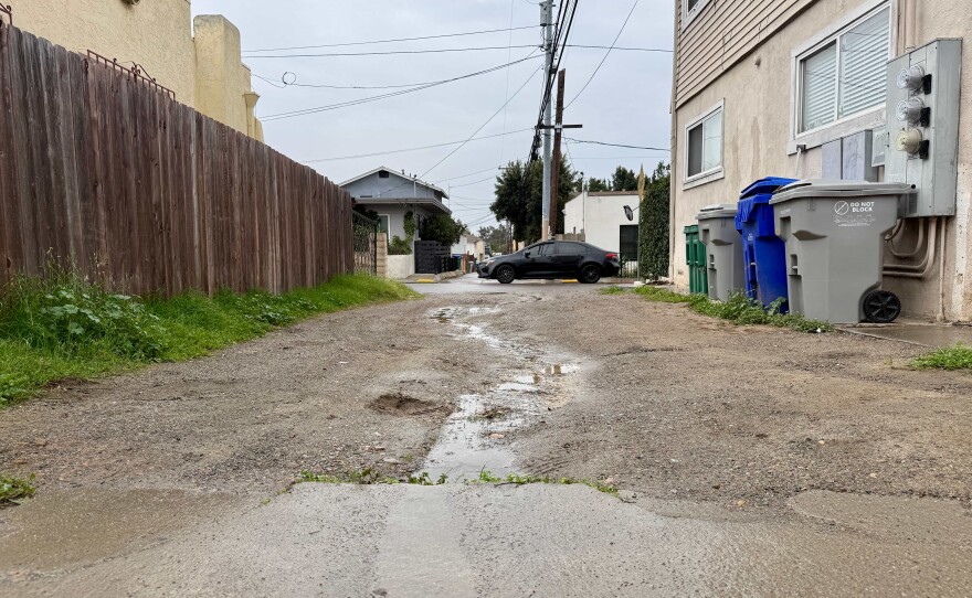 Puddles form in a North Park alley on Dec. 31, 2025.