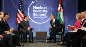 President Obama meets with King Abdullah II of Jordan on the first day of the Nuclear Security Summit in Washington, D.C., as other delegates, including U.S. Secretary of State Hillary Clinton, look on.
