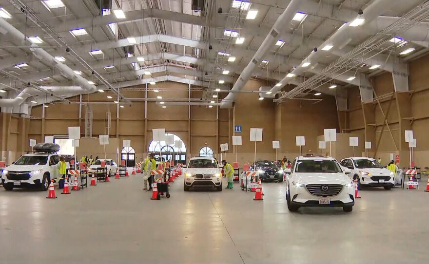 Cars lined up at the vaccination super station on the Del Mar Fairgrounds. Feb. 12, 2021.