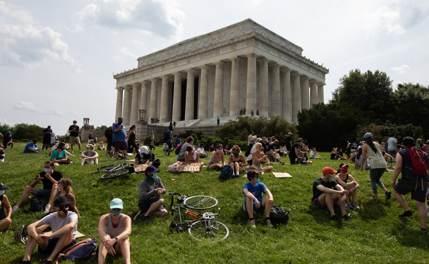 Thousands of people gather Saturday near the Lincoln Memorial in Washington, D.C., following a demonstration at the Dirksen Senate Office Building to protest police brutality.