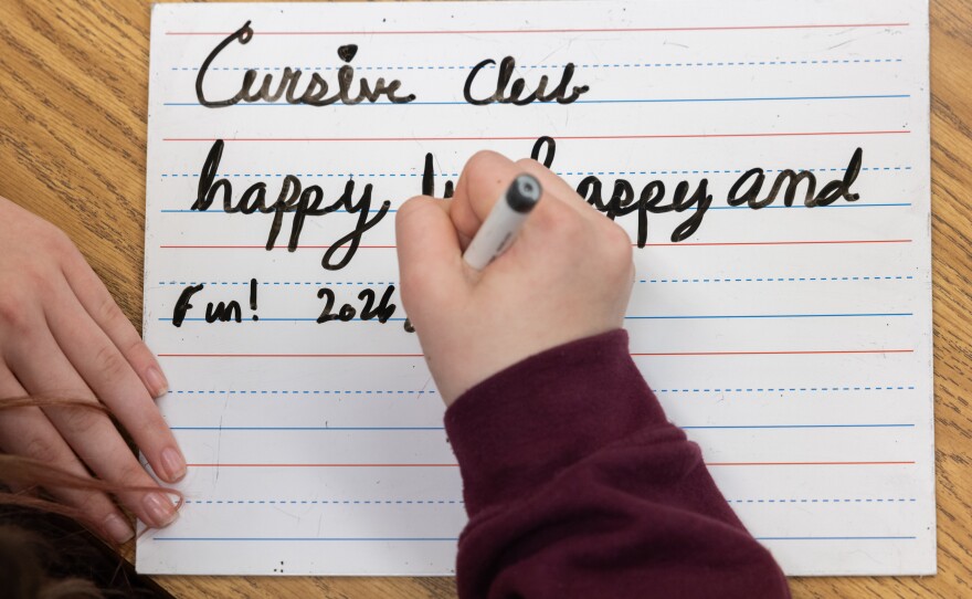 Conrad Thompson writes during cursive club.