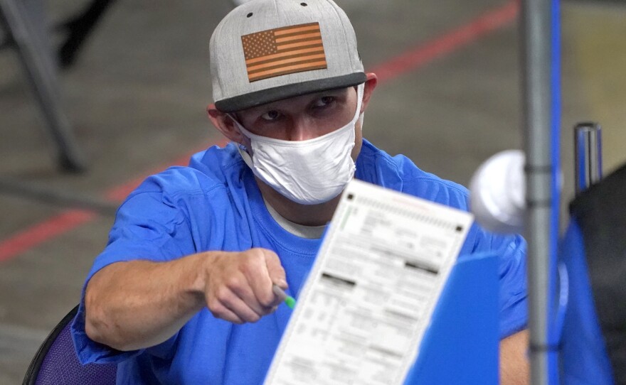 Maricopa County, Ariz., ballots cast in the 2020 general election are examined in May.