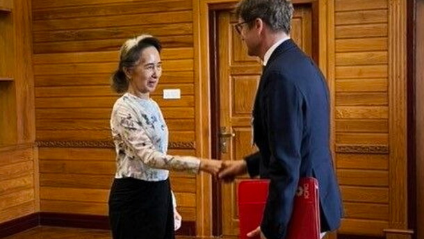 In this photo released by Myanmar President Office on Monday, Aug. 3, 2026, Myanmar's ousted leader Aung San Suu Kyi, left, shakes hands with Arnaud de Baecque, resident representative of the International Committee of the Red Cross, during their meeting in Naypyitaw, Myanmar.