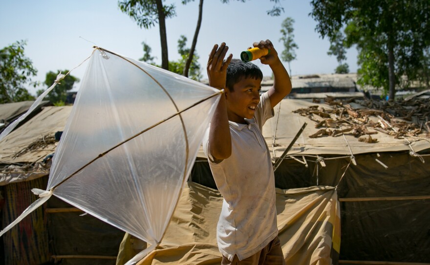 Fayes Khamal tests out a kite he's just made in the Hakimpara Rohingya refugee camp in Bangladesh.