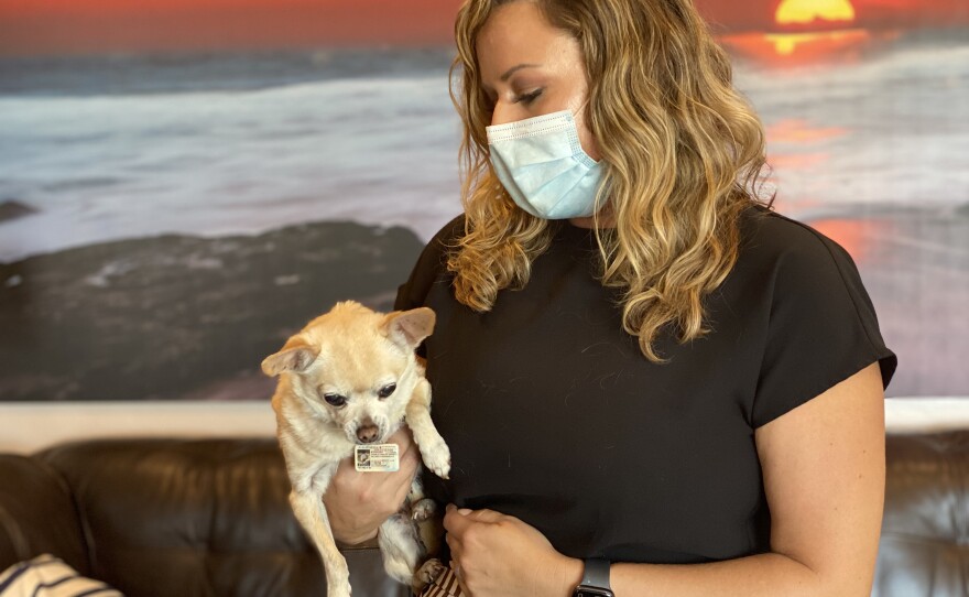 Brittany Goyette, a licensed ICU registered nurse, and her dog Charlie in her rental unit in San Diego, Oct. 22, 2020.