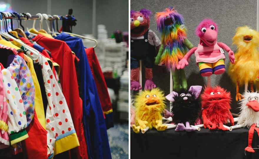 Clown clothes and puppets at the convention.