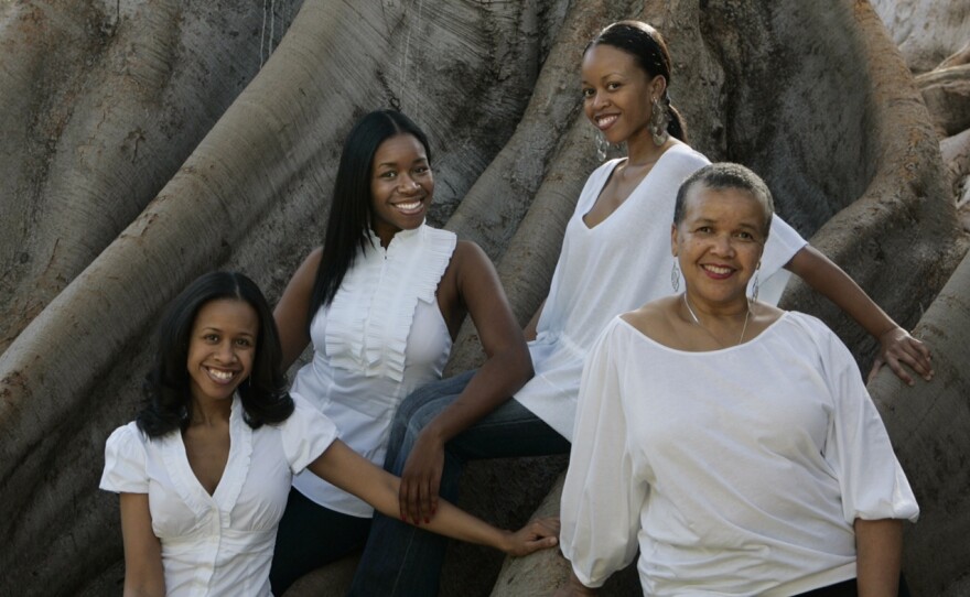 Lewis and her daughters left to right: Sherehe (Celebration), Aisha (Life & Love), and Khaleedah (Everlasting).