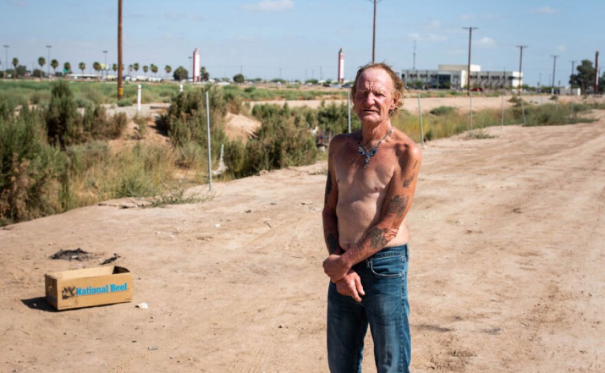 Carl Wilkinson lives on a stretch of dirt not far from Imperial County’s indoor mall. He likely qualifies for a COVID hotel room through California’s Project Roomkey but said he lost his ID and has not tried applying.