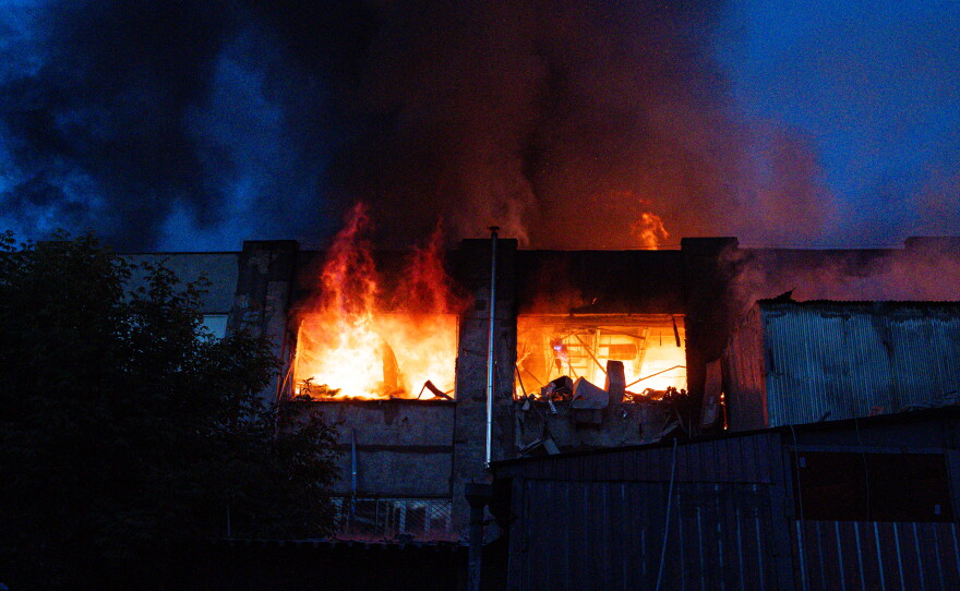 Flames engulf a building after the attack in Kyiv, Ukraine.