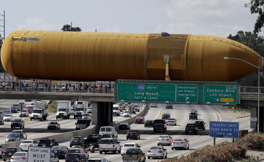 The last remaining space shuttle external propellant tank is moved across the 405 freeway in Los Angeles on Saturday. The ET-94 will be displayed with the retired space shuttle Endeavour at the California Science Center.