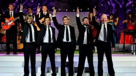 Promotional photo of Celtic Thunder on stage for "Celtic Thunder Christmas," filmed in Poughkeepsie, N.Y. in front of a live audience. 