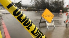 Police tape was placed on flooded roads in Mission Valley during a winter storm, Feb. 14, 2019.