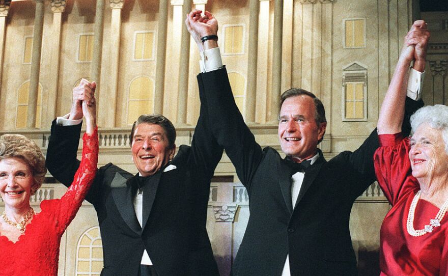 President Ronald Reagan with presidential hopeful George Bush after Reagan announced his endorsement of Bush as the next U.S. president, November 1988.
