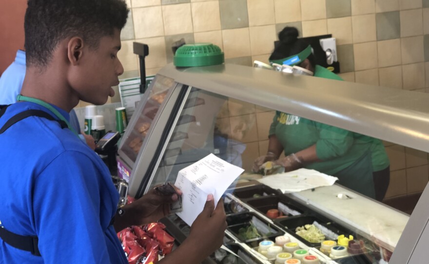 Devin Wells orders a sandwich, June 27, 2018.