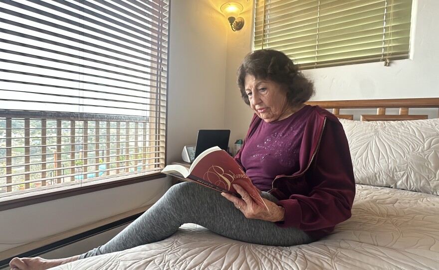 Barbara Sikking is shown in her bedroom reading a book on December 31, 2024.