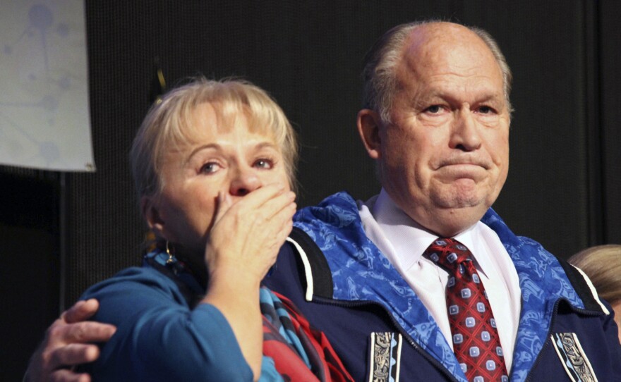 Donna Walker blows kisses to the crowd as her husband, Gov. Bill Walker, announced he was suspending his re-election bid and supporting Democrat Mark Begich. He has been far behind in the polls, and his lieutenant governor resigned for an "inappropriate overture" three days earlier.