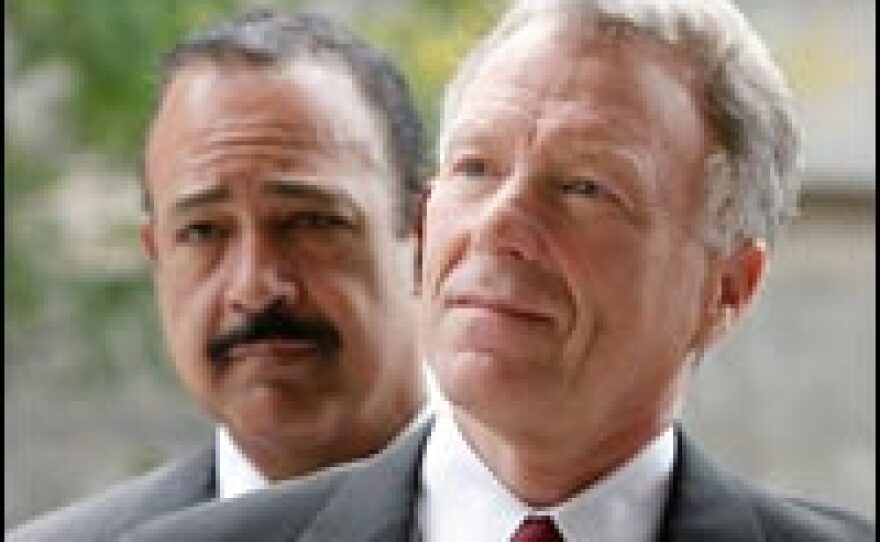 I. Lewis "Scooter" Libby and his attorney Theodore Wells (left) arrive for a hearing at the federal courthouse in Washington, D.C., June 14, 2007.