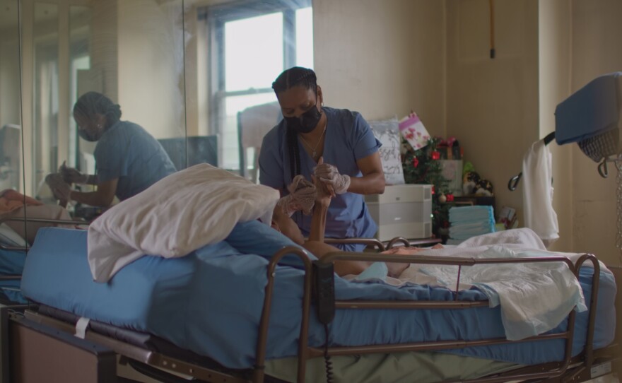 Zulma Torres, a professional caregiver in The Bronx, NY, cares for a client during the COVID-19 pandemic.