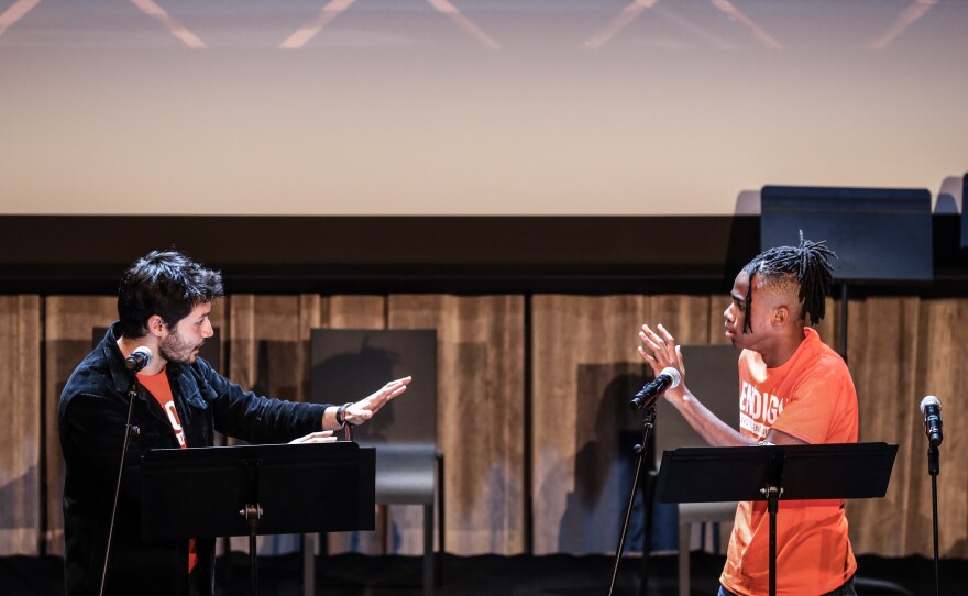 Two young actors, Camilo Linares and Calvin Marshall, perform in Niarra C. Bell's play <em>The Smiles Behind.</em>