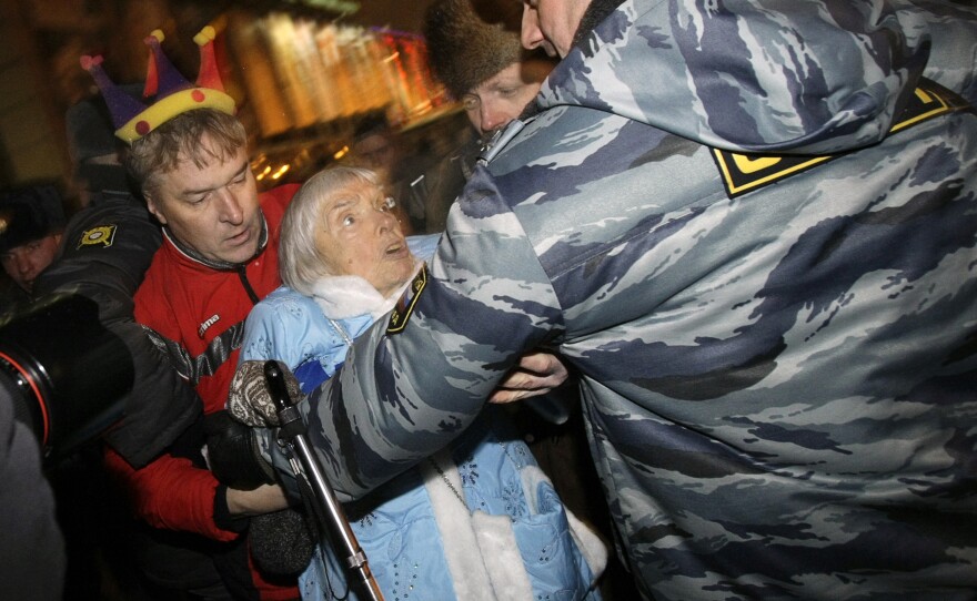 Police officers detain Alexeyeva during a New Year's Eve anti-Kremlin protest in downtown Moscow in 2009.