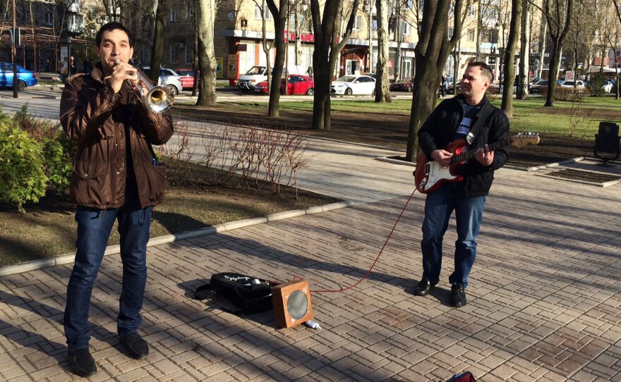 Unfazed by the political turmoil a few blocks away, street musicians in Donetsk play Adele songs on Pushkin Boulevard.