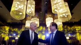 California Gov. Jerry Brown, left, chats with China's Science and Technology Minister Wan Gang as they attend the Clean Energy Ministerial International Forum on Electric Vehicle Pilot Cities and Industrial Development, at a hotel in Beijing, Tuesday, June 6, 2017.