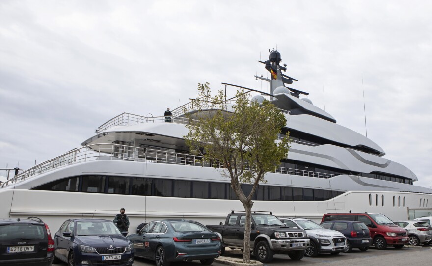 A Civil Guard stands by the yacht called Tango in Palma de Mallorca, Spain, on Monday. U.S. federal agents and Spain's Civil Guard are searching the yacht owned by a Russian oligarch.