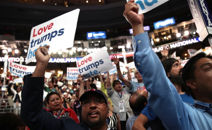 Delegates at the Democratic National Convention in Philadelphia in July hold up signs that read "Love trumps hate."