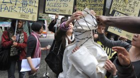 Protesters from Amnesty International in Hong Kong demonstrate in March 2009 against the death penalty in China. The human-rights group says China executed more than 1,700 people in 2008, roughly three-quarters of the world total.