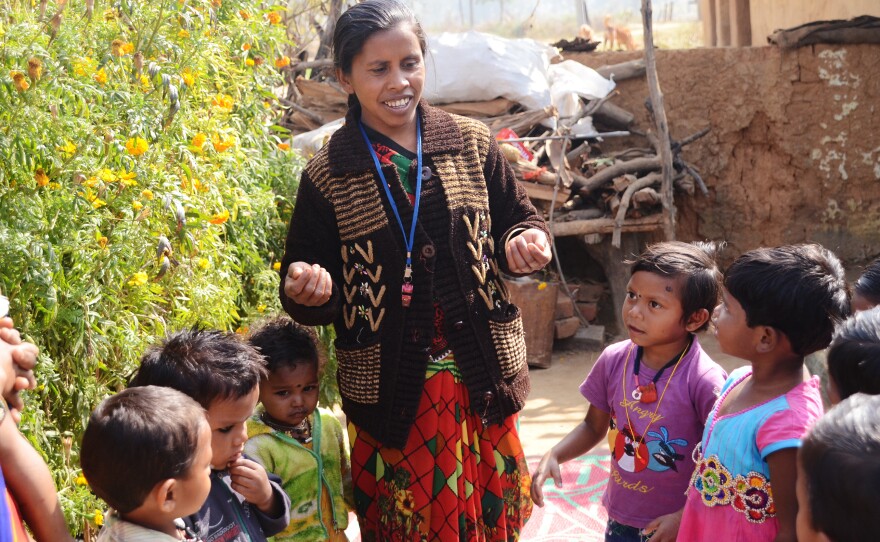 Nursery worker Shivkumari Pate leads children in a learning song. Pate works with the nonprofit Jan Swasthya Sahyog, which developed the first network of community nurseries.