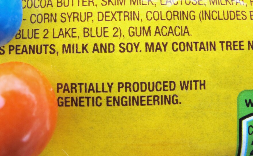 A new disclosure statement on a package of peanut M&Ms candy notes they are "partially produced with genetic engineering."