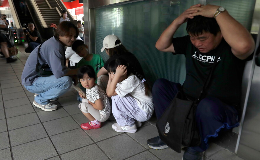 People take cover inside at a MRT station during the Urban Resilience (Air-Defense) Exercise, part of the annual Han Kuang military exercises in Taipei, Taiwan, Thursday, Aug. 13, 2026.